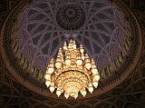 Muscat 04 Grand Mosque 05 Chandelier Hanging From Central Dome The main prayer hall has a large ornate chandelier made of Swarovski crystal and gilded metals hanging from the central dome, which  rises to a height of 50m above the floor.